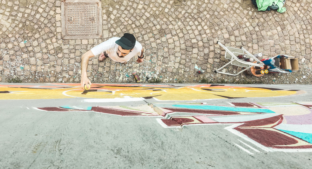 Man painting a mural