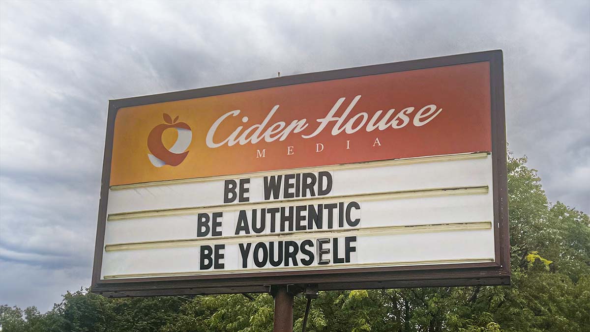 The (almost) world famous Cider House Sign with the message, "Be weird, be authentic, be yourself."