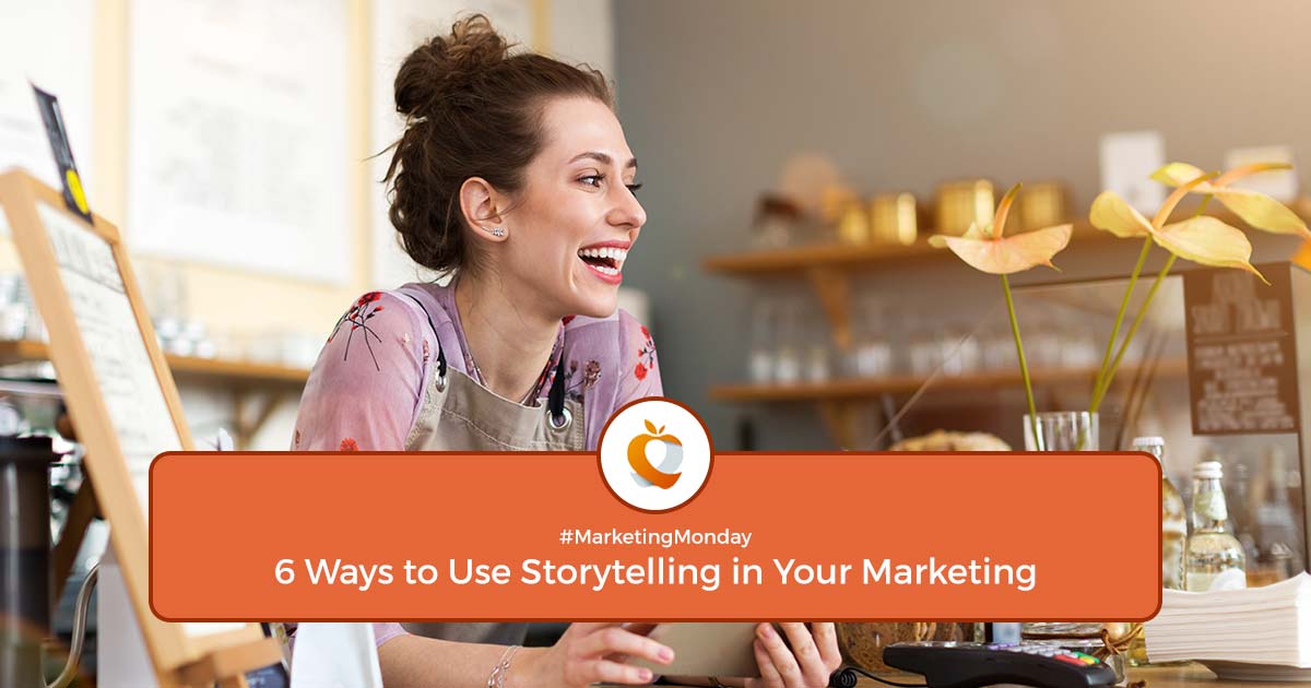 Sarah, a coffee shop owner, smiles while using her tablet, illustrating how small business owners can use storytelling in their marketing to connect with customers.