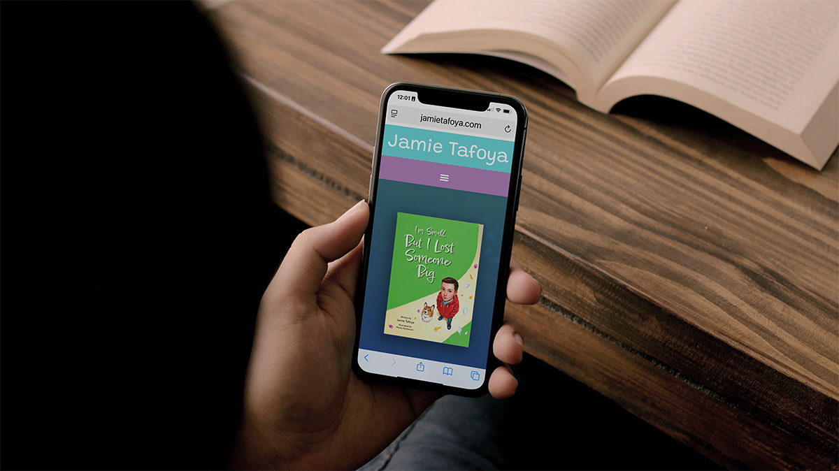 Children's book author Jamie Tafoya's website showing on the screen of an iPhone.