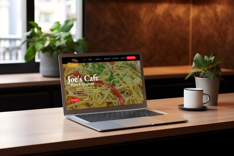 Renering of the Joe's Care website on a Macbook pro, sitting on a kitchen counter