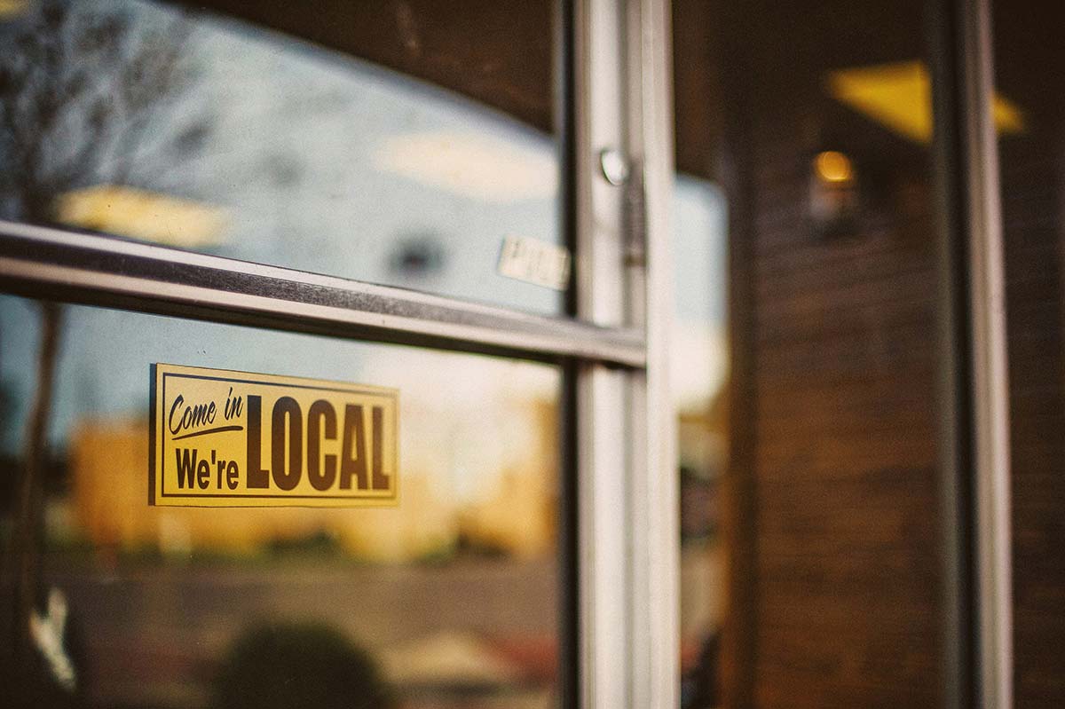 Local business storefront sign reading “Come in, we’re local,” custom WordPress web design in Western Massachusetts