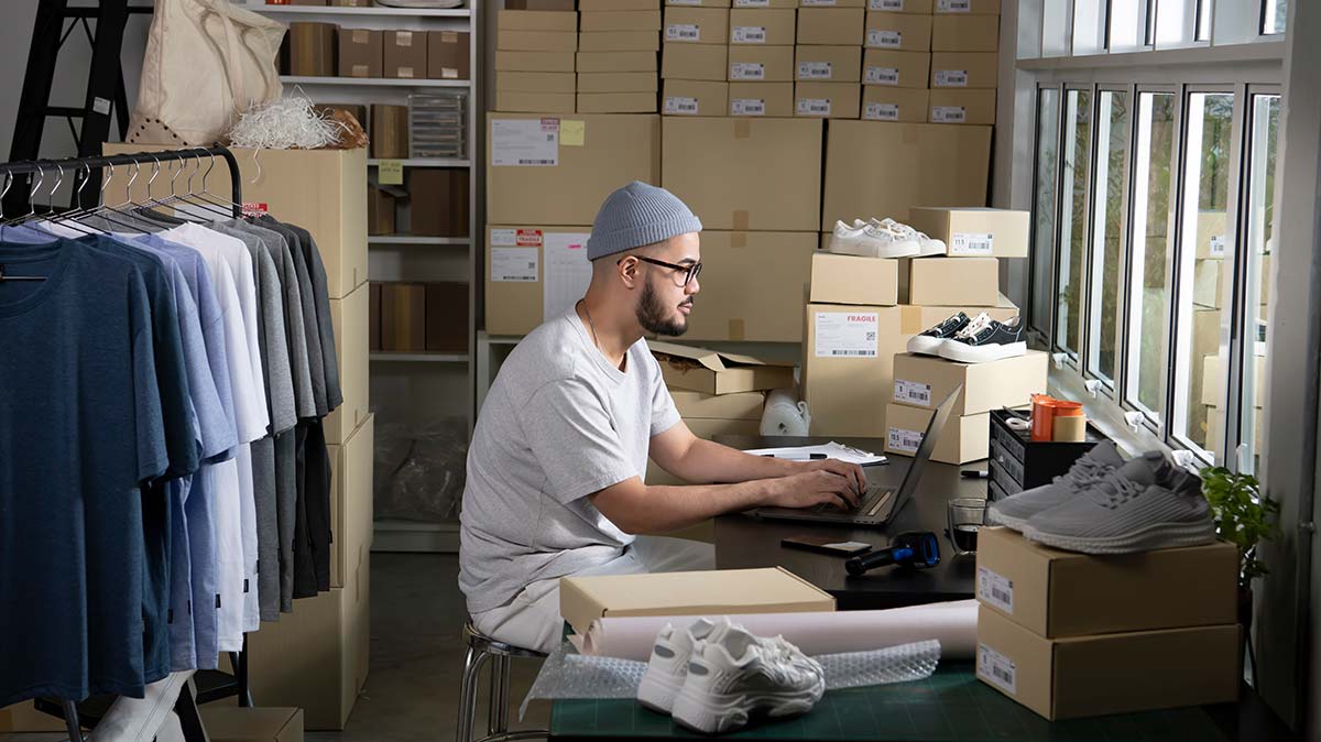 Small business owner using practical small business resources to manage inventory and online operations