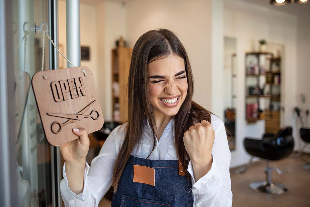 Small business owner celebrating opening day and growing a local business
