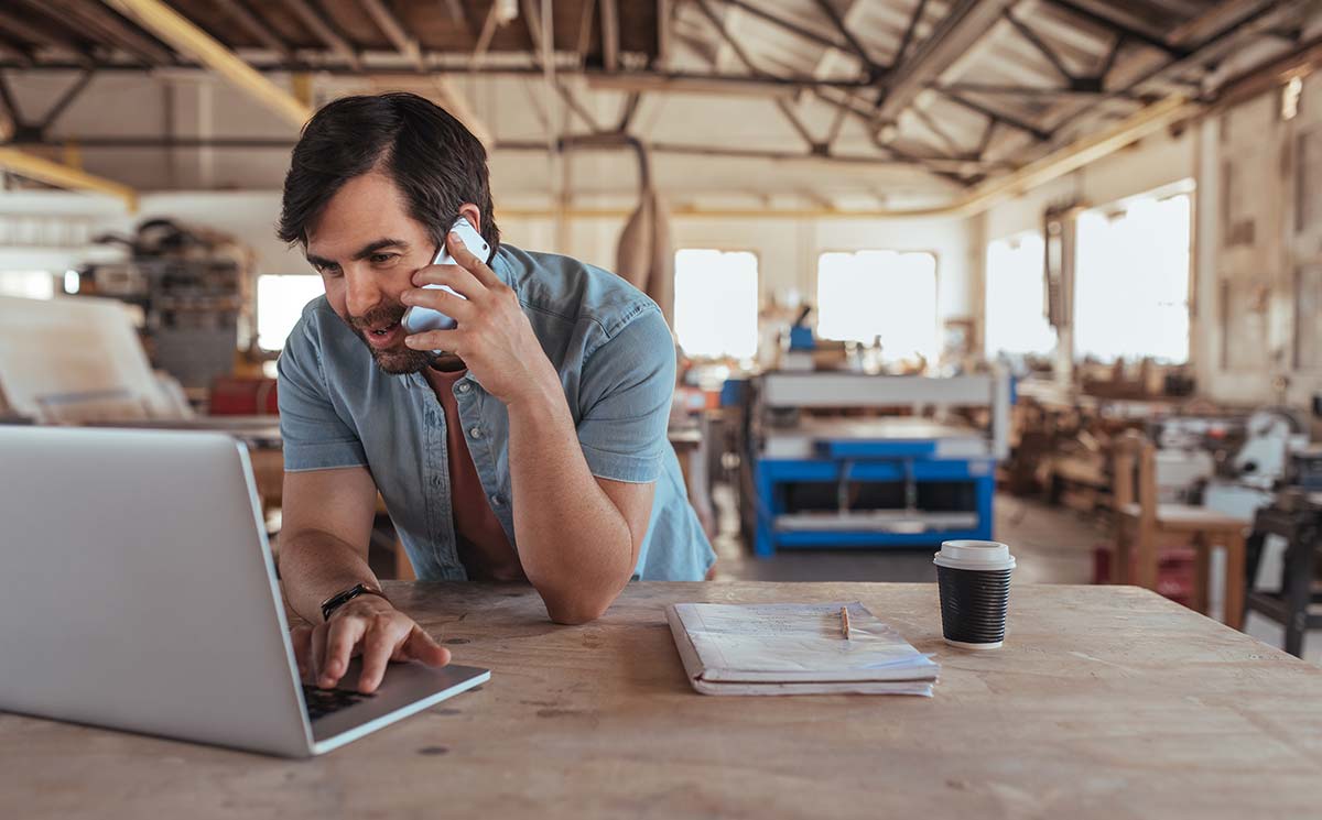 Small business owner using practical small business resources to manage inventory and online operations