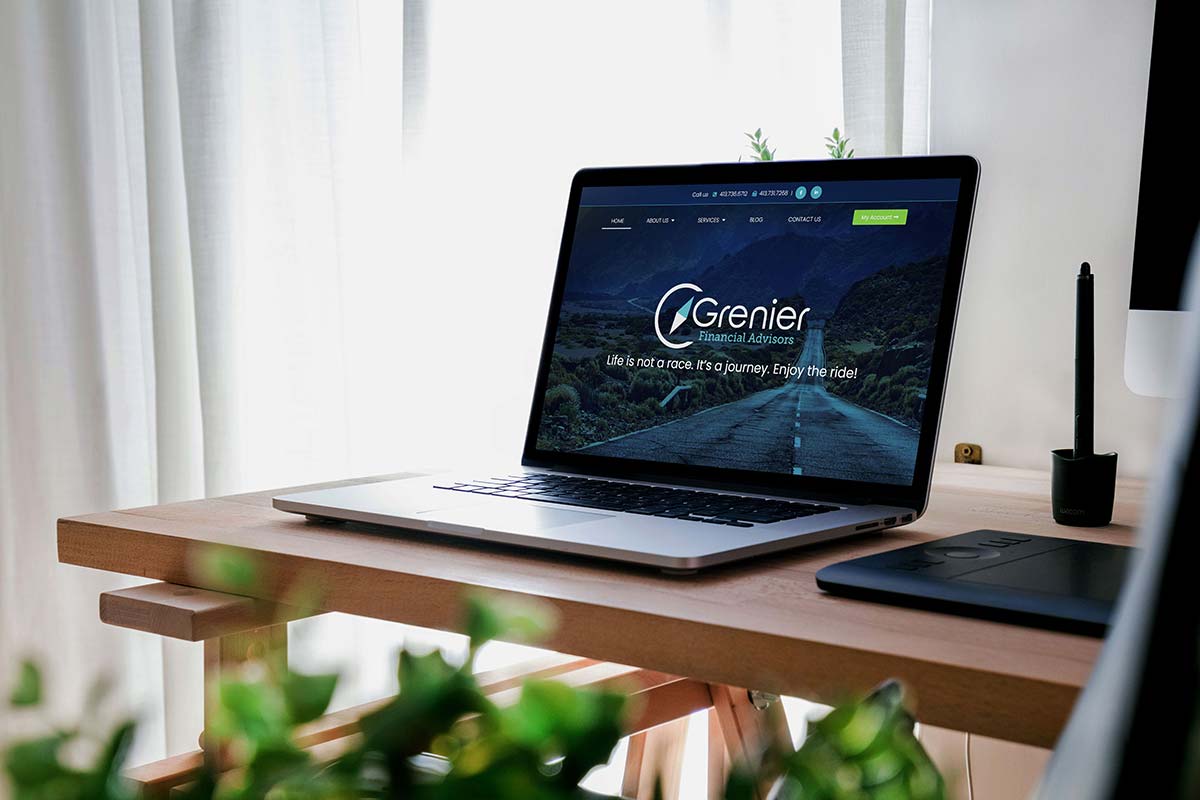 MacBook rendering of Grenier Financial Advisors's WordPress website designed by Cider House Media