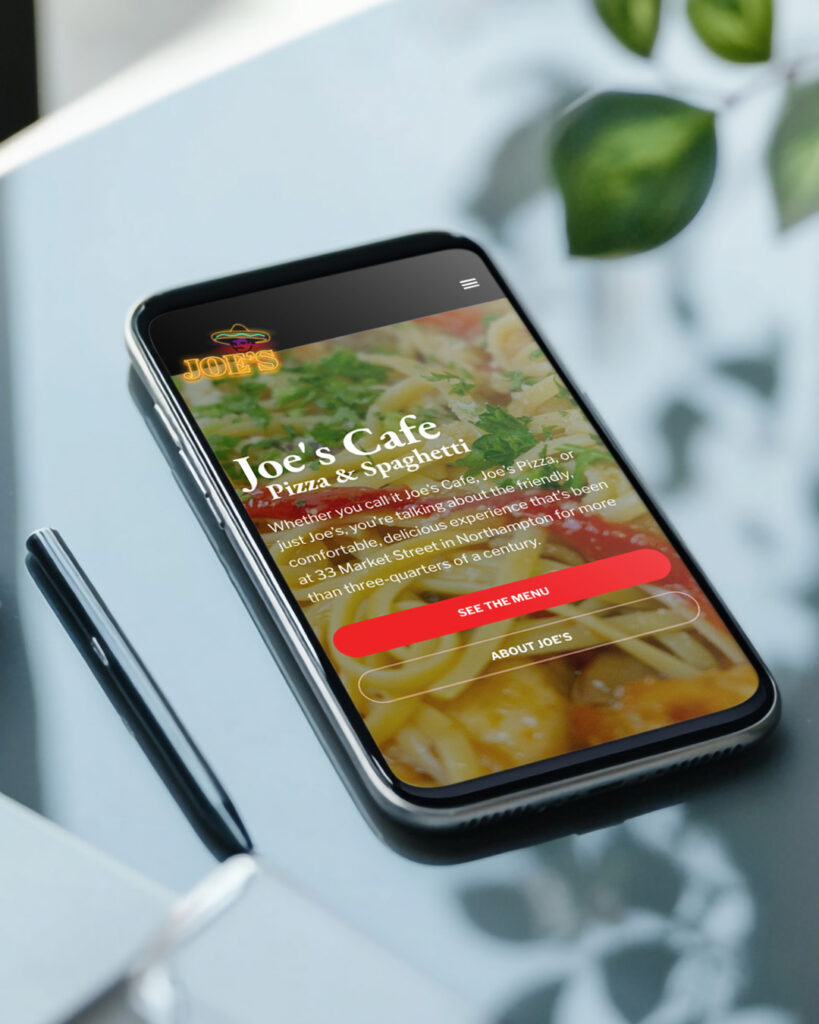 mockup of Northampton MA restaurant, Joe's Cafe website on a mobile phone