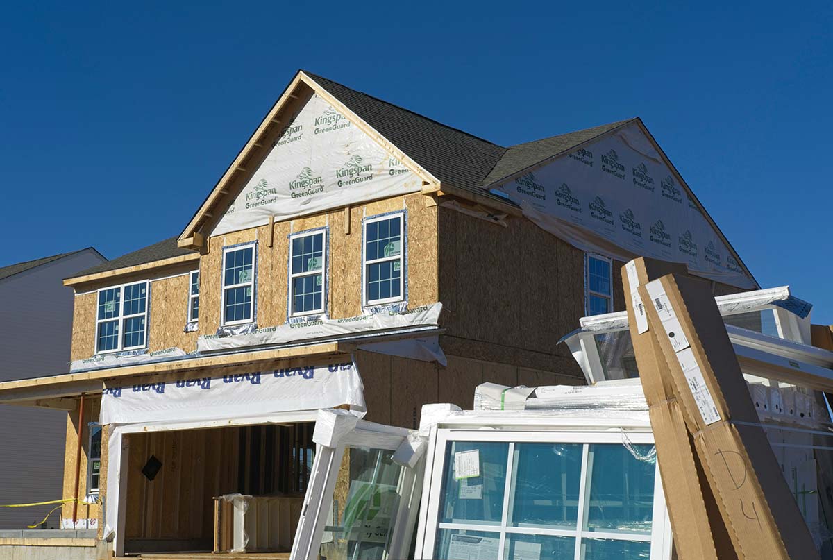 New home under construction with framing and materials, representing scalable website builds and long-term growth