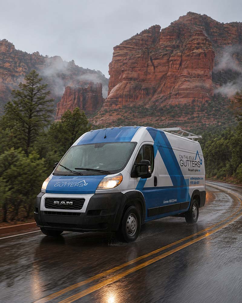 On The Edge Gutters' van on a rainy-soaked Sedona road