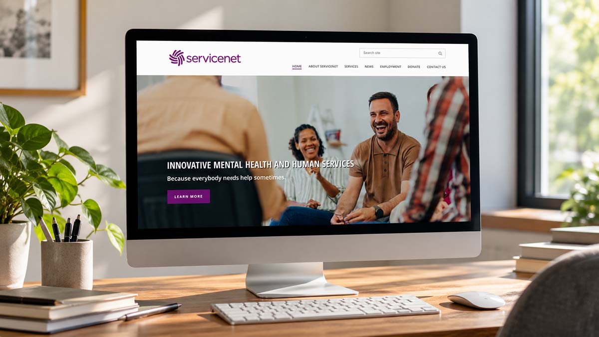 ServiceNet mental health and human services website displayed on a desktop computer.
